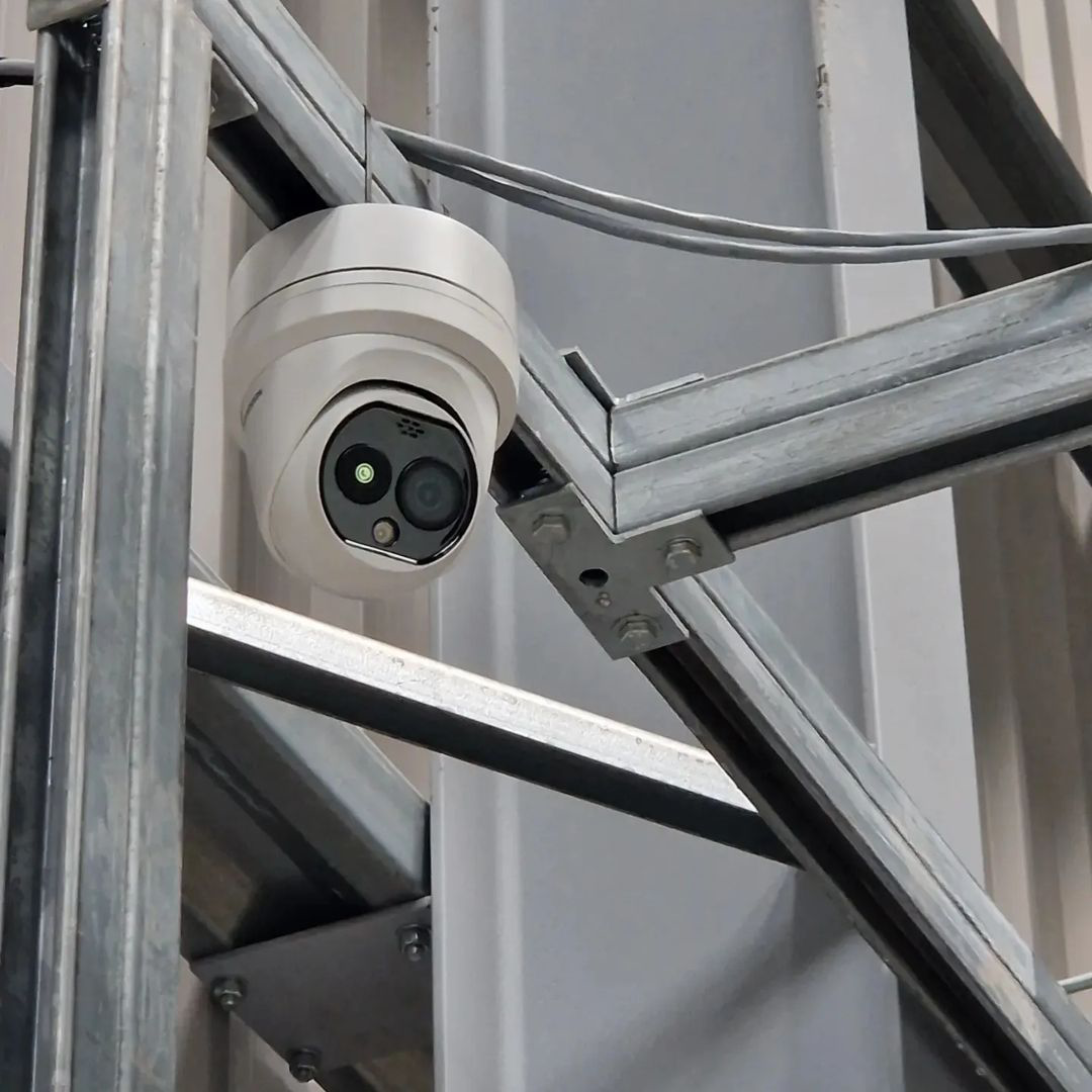 Home with professionally installed CCTV camera at dusk